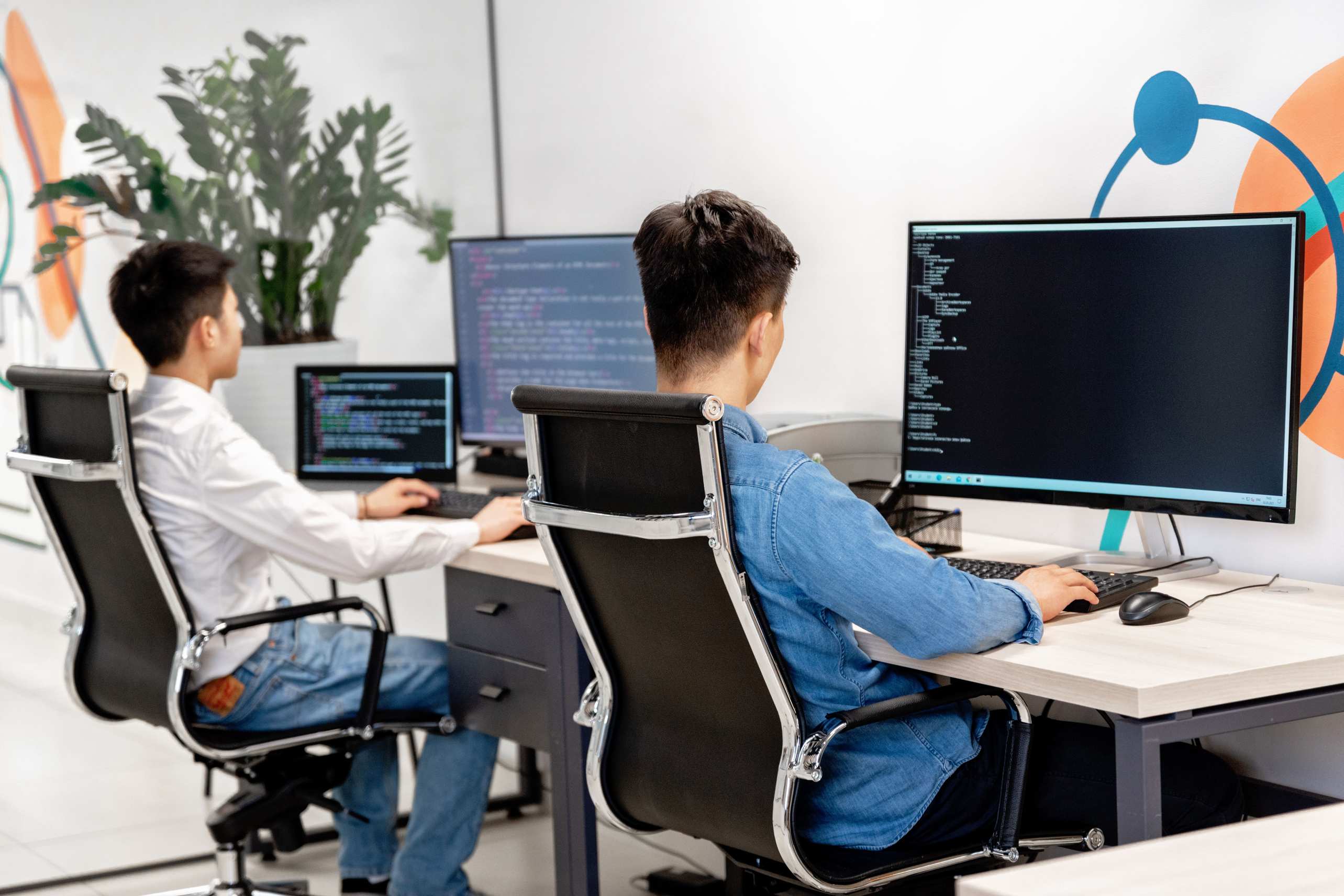 Developer workspace with code on screen in a modern office